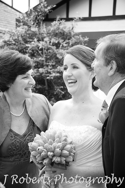 Bride laughing parents outside family home Eastwood - wedding photography sydney